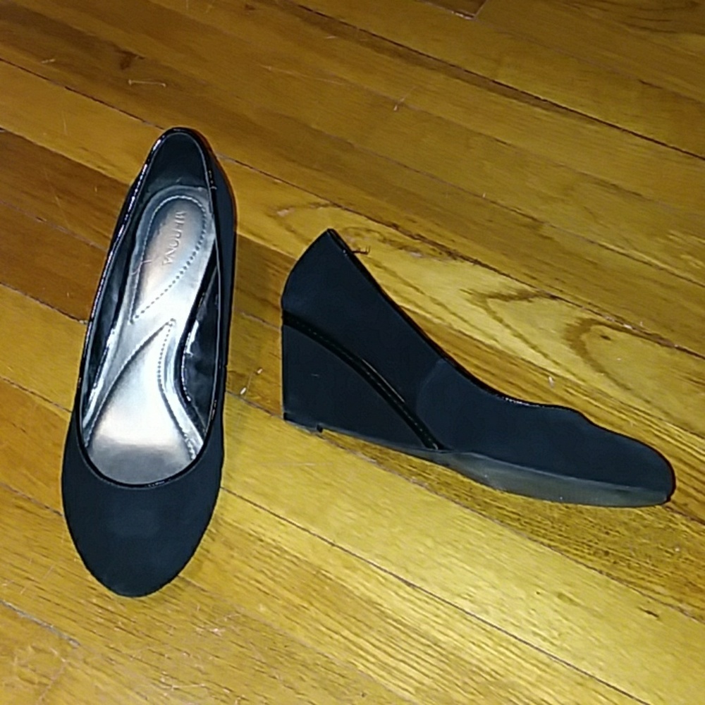Black suede wedge pumps